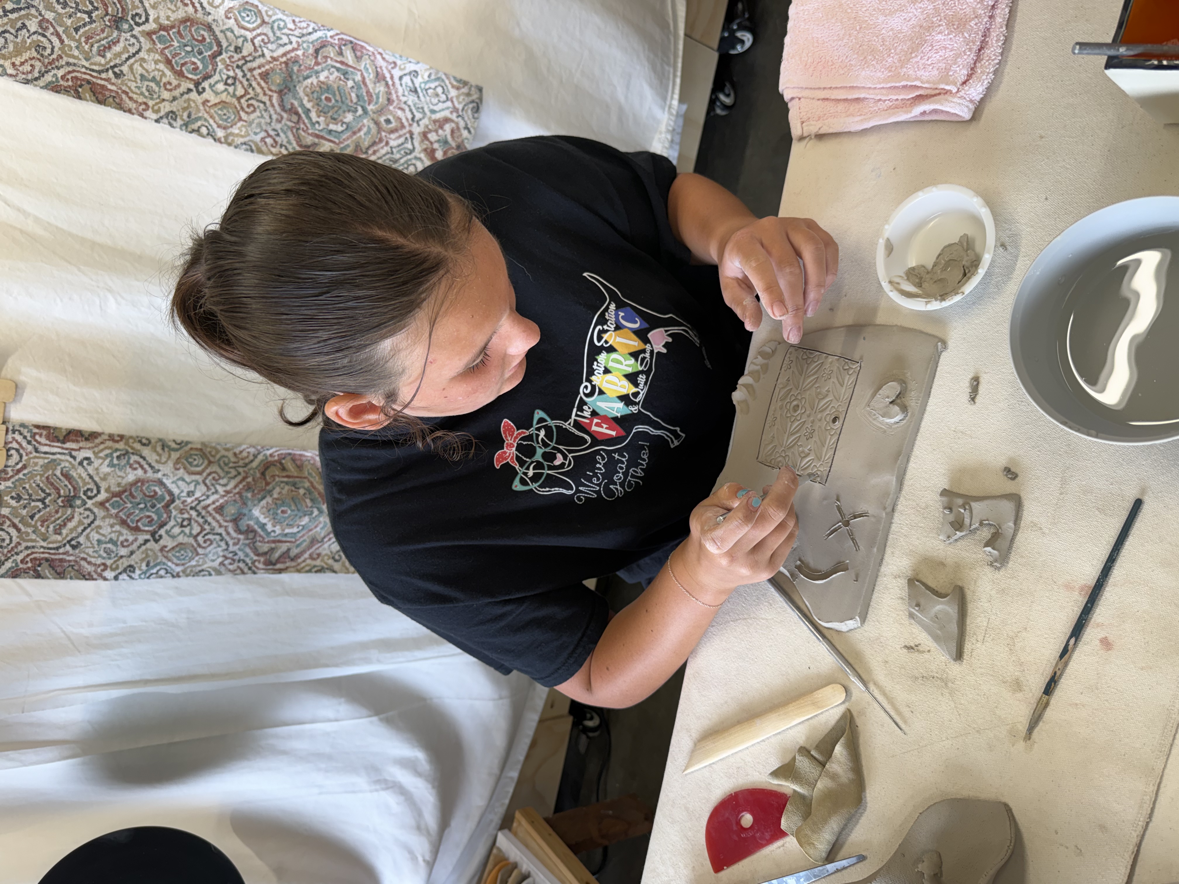 Scout building with clay at Mud Mojo