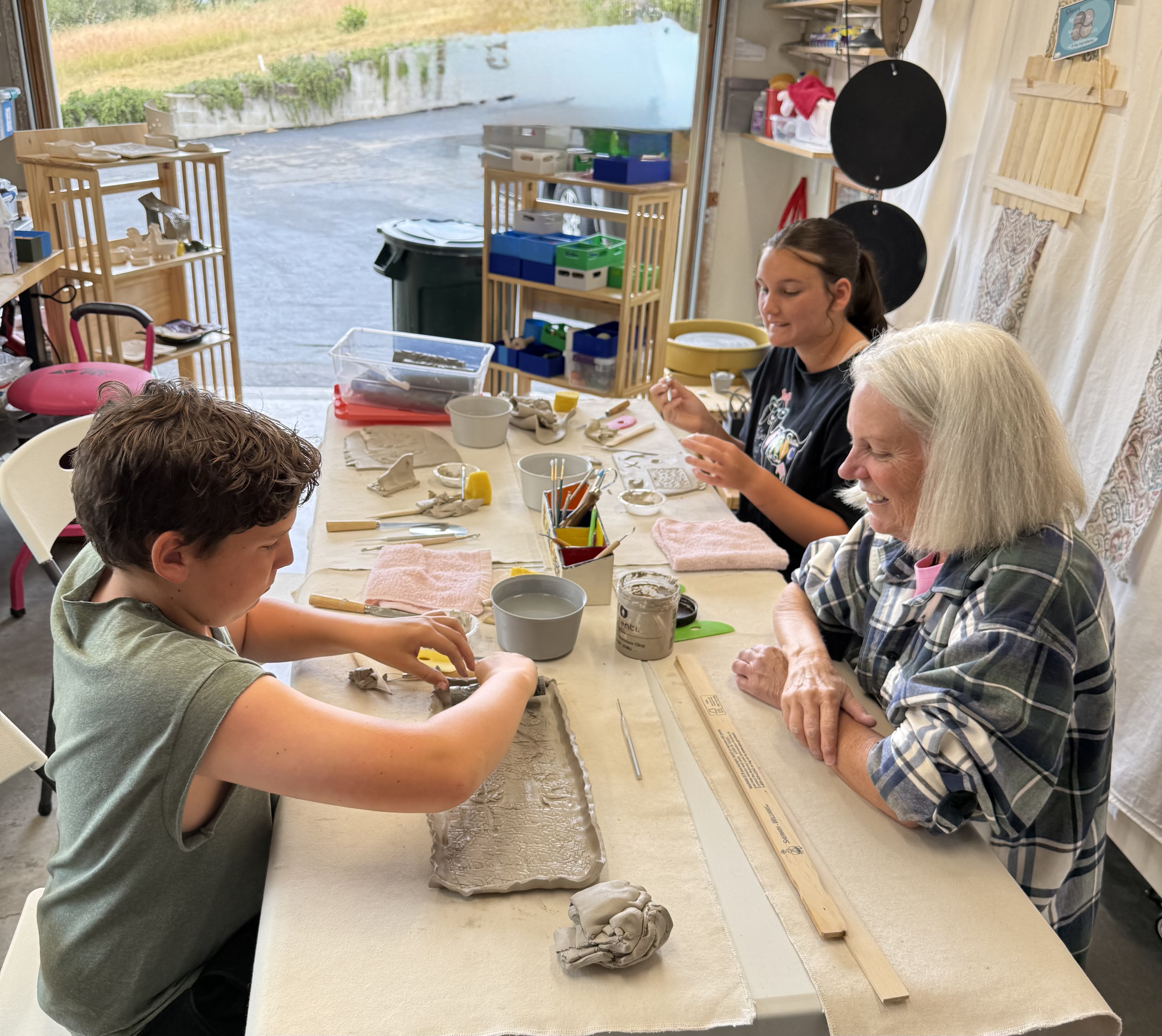 Scouts working at the clay table at Mud Mojo
