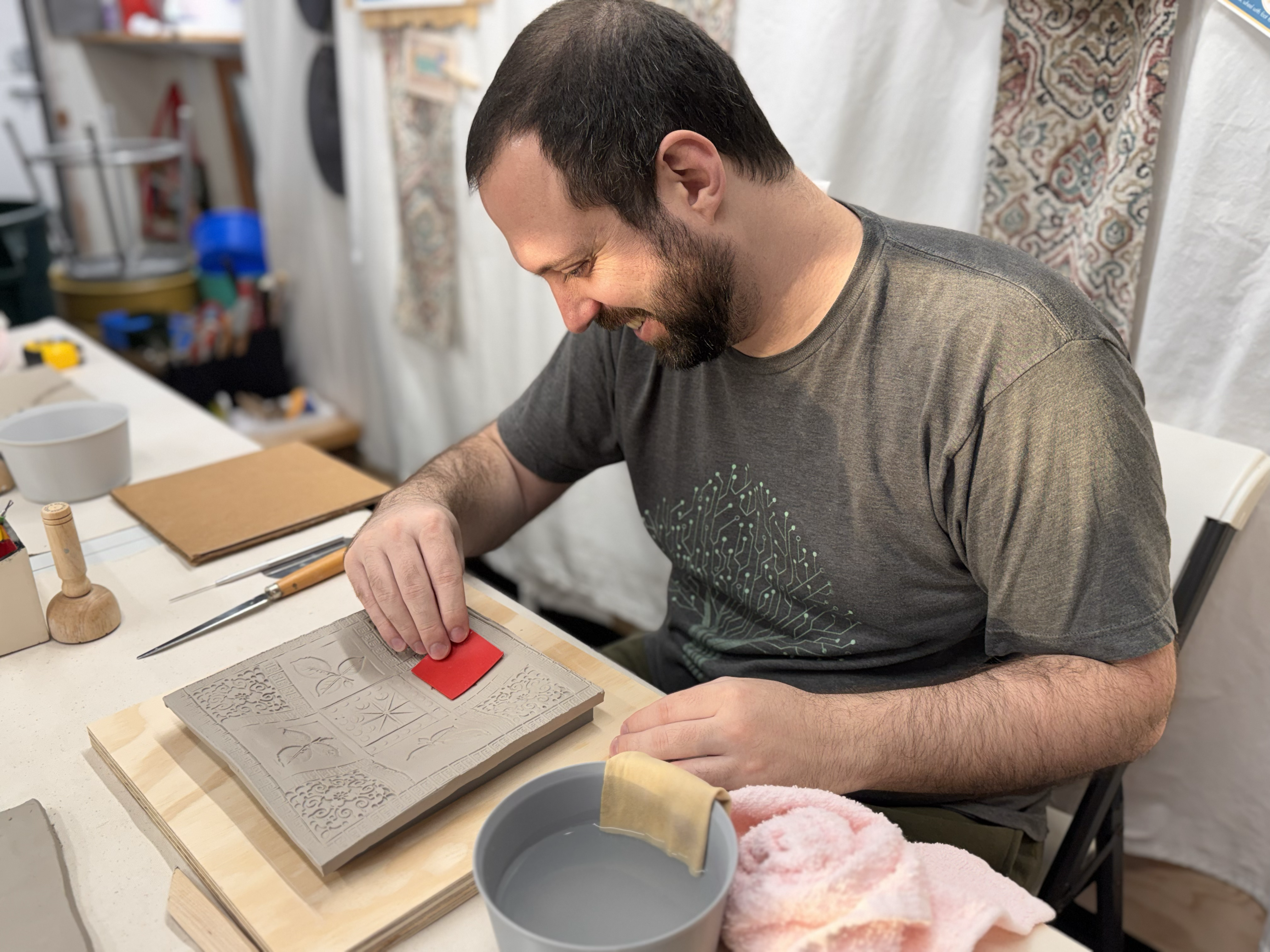 Student working with clay in the studio